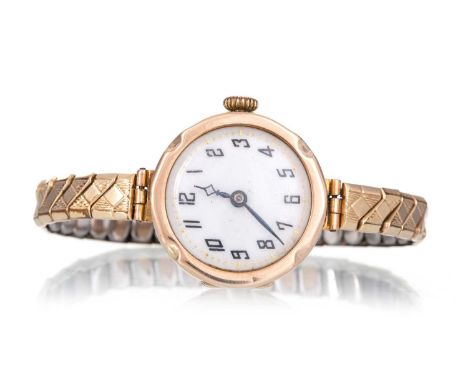 NINE CARAT GOLD CASED MANUAL WIND WRIST WATCH the round dial with Arabic hour markers, 25mm case, on a rolled gold expanding 