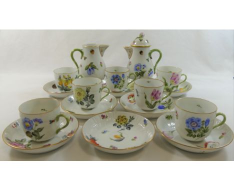 A Herend porcelain part coffee service, comprised of seven cups, eight saucers, coffee pot and milk jug, all with green handl