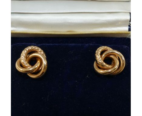 A pair of large yellow metal knot earrings, the stick backs stamped '585', combined weight 5g, 1.8cm diameter, boxed CONDITIO