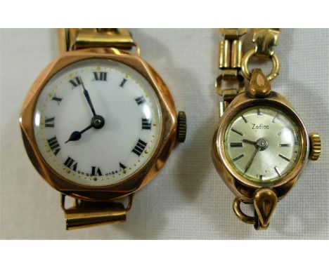 A 9 carat gold ladies wrist watch, London 1928, the circular white enamel face with Roman numerals, housed in hexagonal facet