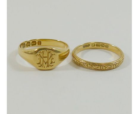 An 18 carat gold signet ring, Birmingham 1891, finger size L, and an 18 carat gold wedding band with engraved scrolling decor