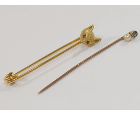 A 9 carat gold foxes head stock pin, London 1957, 5.2cm long, 4.6g, and a stick pin set with a small rose cut diamond and a c