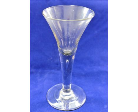 A late Georgian wine glass with trumpet bowl, the stem with single tear-shaped bubble, 17cm high CONDITION REPORT: If you req