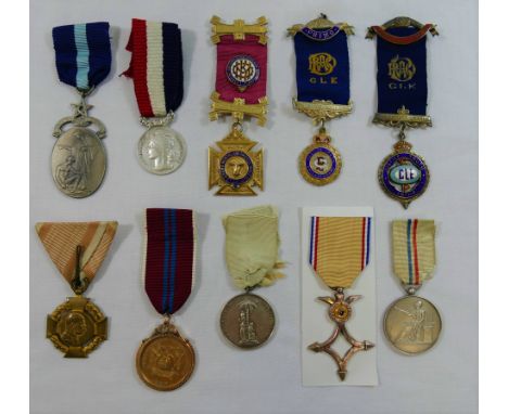 An 1897 India Army Temperance silver medal, an Alliance Francaise silver medal, an Austrian Empire Jubilee Cross Civil Servic