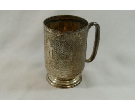 An Edwardian silver christening tankard, Birmingham 1904 by Deakin and Francis, of cylindrical form, raised on circular pedes