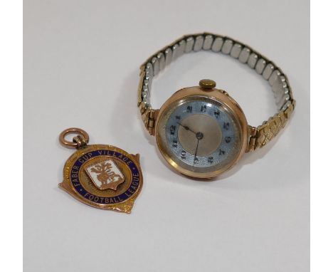 A 9 carat gold and enamel 'Faber Cup Village Football League' medal, Birmingham 1925, 7.6g gross and a 9 carat gold cased lad