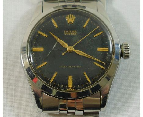 A 1950's gentleman's Rolex Oyster wrist watch, with black face and gilt baton numerals and hands, housed in stainless steel c