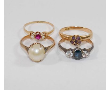 An 18 carat gold seed pearl and ruby three stone ring, finger size Q, 1.4g gross, a D-shaped band set with small round amethy