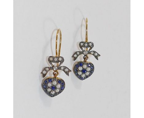 A pair of sapphire, diamond and cultured seed pearl heart-shaped cluster drop earrings with bow surmounts, the heart-shaped c