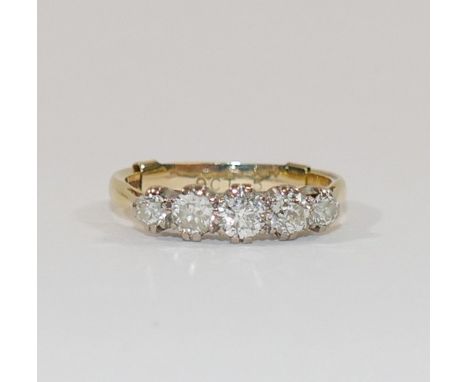 An 18 carat gold diamond five stone ring, Birmingham 1998, the round brilliant cut stones combined weight approximately 0.85 