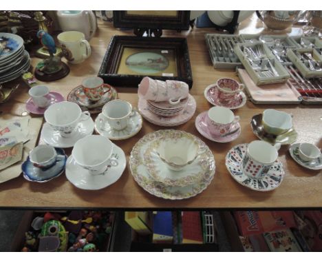 A selection of decorative cups and saucers including Mintons 'Rosetta' part coffee service, Masons etc