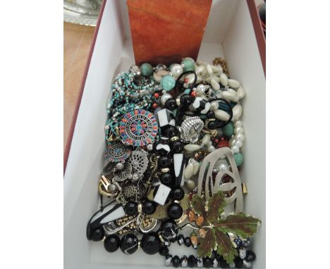 A box of costume jewellery including necklaces and broaches etc and treen inlaid playing card holder