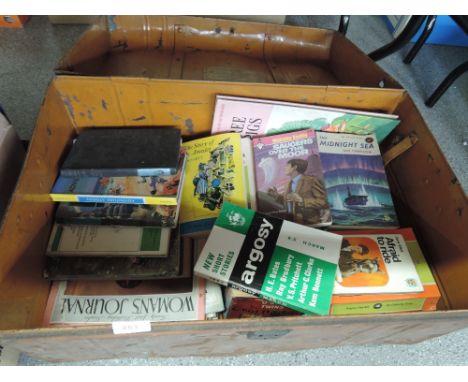 A vintage tin trunk of books