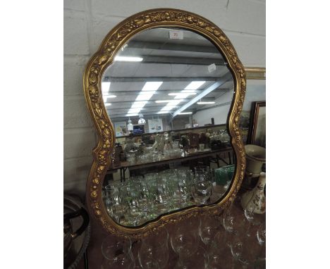 A gilt framed dressing table mirror