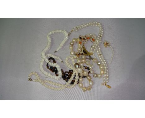Bag of assorted costume jewellery including pearl necklace, beads etc.