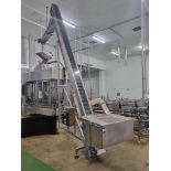Cap elevator with hopper at base and high level conveyor Circa 6m high