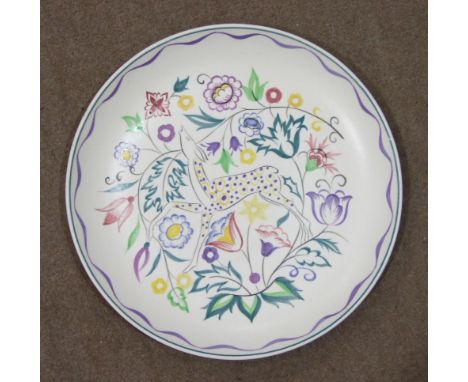 A Poole Pottery circular wall plaque, the centre decorated with stylised fruit, 32.5cm diameter, a Poole Pottery 'Persian Dee