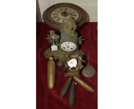 A circular wall hanging wood case 'Postman's' alarm clock, 27cm diameter, a gilt spelter mantel clock and a brass carriage cl
