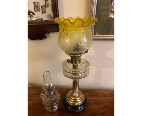 Oil lamp with brass Corinthian column and cracked coloured shade with another glass lamp and two decanters