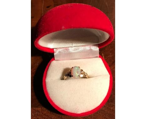 Opal and diamond ring set in 14 ct.gold size O