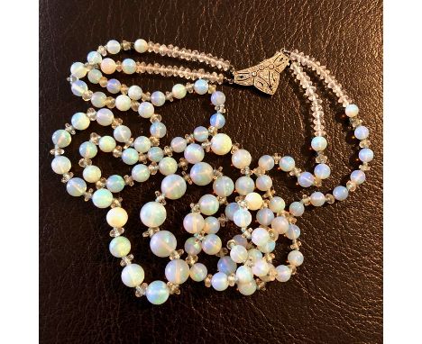 Good graduated opal bead necklace, the two rows with an 18ct white gold, platinum and diamond clasp 61cm long condition is ex