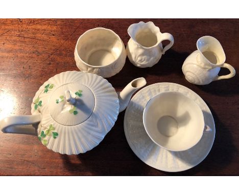 Belleek porcelain, teapot, 2 jugs bowl and a cup and saucer 1 jug cracked and teapot chipped