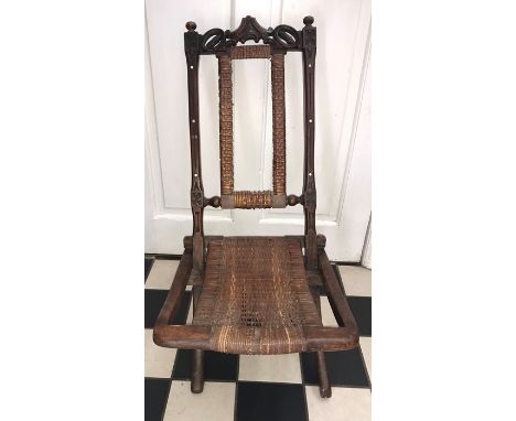 A 19thC folding chair together with a firescreen with stamps on. 