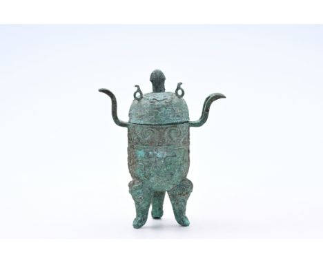 An unusual Chinese bronze ritual food vessel and cover, 'ding', possibly Eastern ZhouH 32 cm - L 25,5 cmProvenance:- The coll