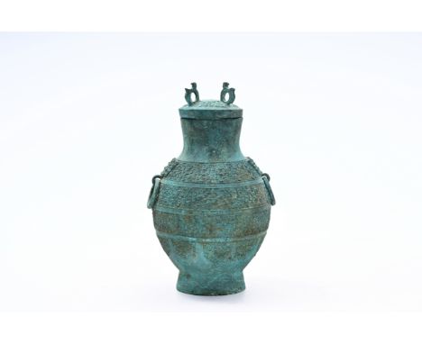A Chinese bronze vase and cover, 'hu', Warring States periodH 34,5 cmProvenance:- The collection of Mr. and Mrs. S., Ghent, B