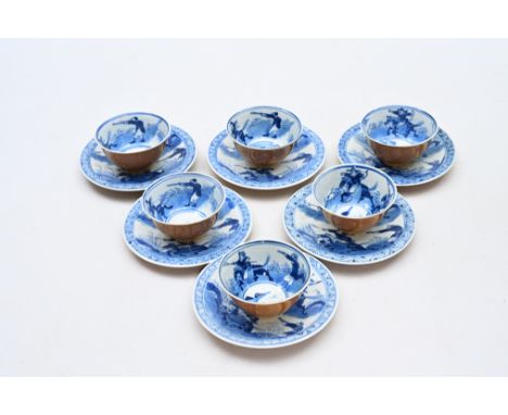 Six Chinese blue and white capucin brown ground 'hunting scenes' cups and six saucers, Kangxi mark, 19th C.Dia.: 13,5 cm (the