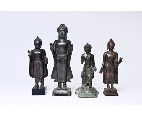 Four bronze figures of Buddha, Thailand and Indonesia, 19th century and/or earlierH 45,5 - 37,5 - 35,5 - 33 cm