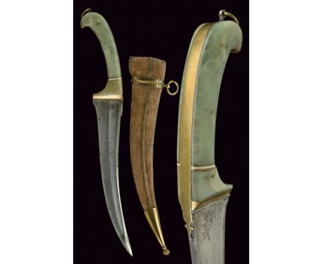 A dagger dating: 19th Century provenance: India Curved, single -and false-edged blade, with "T"-back and slightly strengthene