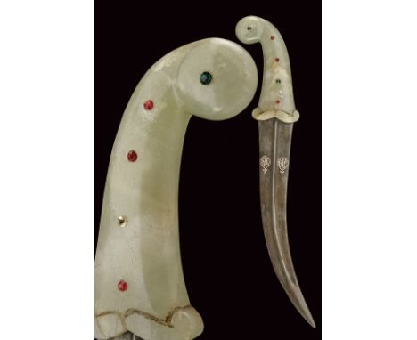 A kandshar with jade hilt dating: second quarter of the 19th Century provenance: Indopersia Curved, double-edged, damask blad