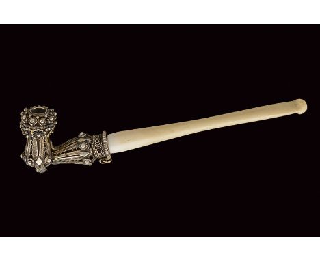 A pipe dating: late 19th Century provenance: Turkey Silver body finely decorated with filigree, bone stem. dimensions: length