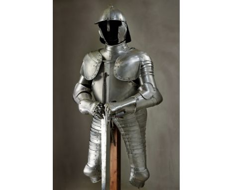 An armour in the style of early 17th Century dating: 19th Century provenance: Germany Lobster-tailed helmet, with iron skull 