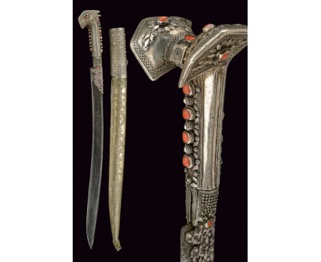 A luxury silver mounted yatagan dating: 19th Century provenance: Turkey Slightly curved, single-edged blade with a thin, rear