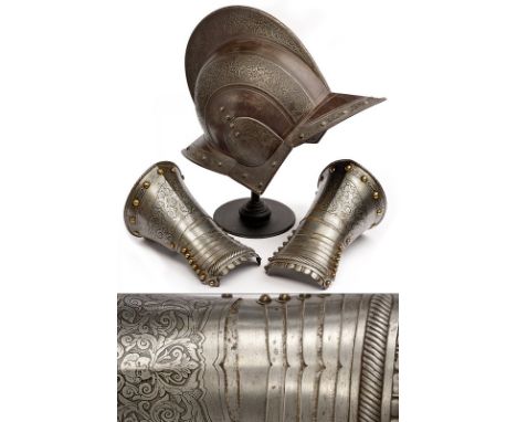 A burgonet and a pair of gauntlets dating: 19th Century provenance: Europe The helmet engraved with bands of floral motifs an