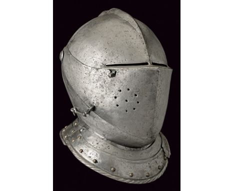 A composite closed helmet dating: late 16th Century provenance: Europe Skull in one piece, lined with leather (probably to we
