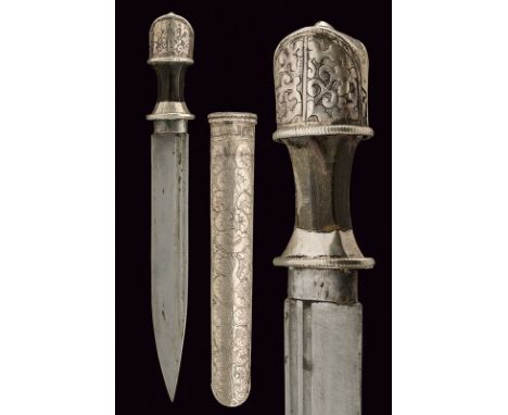 A silver mounted dagger dating: 19th Century provenance: Tibet Straight, single-edged blade with double, rear groove; horn gr