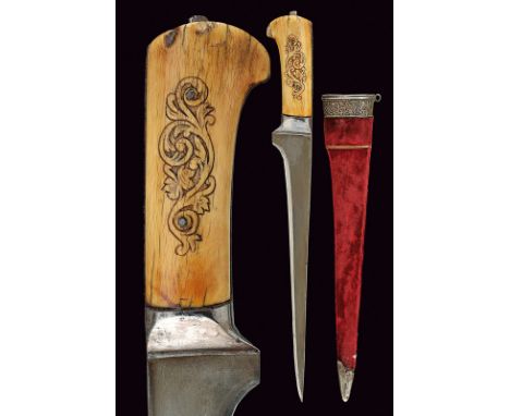 A pesh-kabz with scabbard dating: 19th Century provenance: Afghanistan Straight, single-edged damask blade with "T"-back; iro