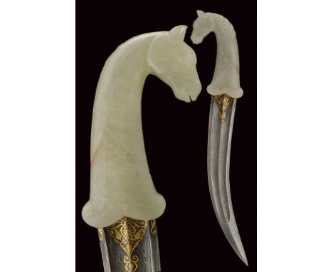 A kandshar with jade hilt dating: early 20th Century provenance: Indopersia Curved, double-edged blade, with double fuller an
