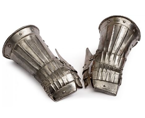 A pair of gauntlets dating: 16th Century provenance: Germany The cuffs and the plates on the back decorated with grooves, rec