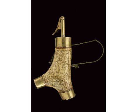 A powder-flask dating: 17th Century provenance: Germany Stag horn body engraved with a medallion featuring the effigy of a ho