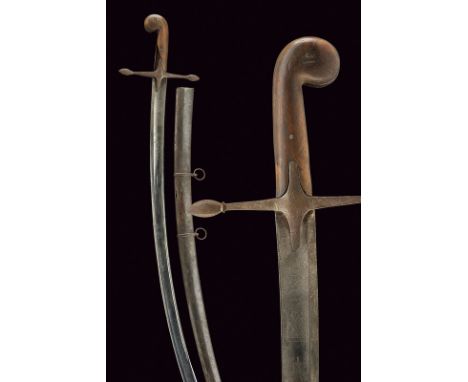 A shamshir dating: first quarter of the 19th Century provenance: Hungary Curved, single -and false-edged blade with wide, cen