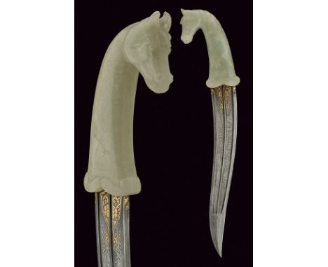 A jade hilted kandshar dating: 20th Century provenance: Indopersia Curved, double-edged damask blade with double groove and c