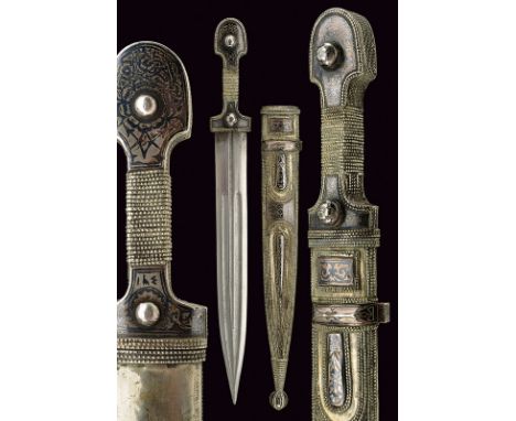 A kindjal dating: late 19th Century provenance: Caucasia Straight, double-edged blade with triple groove; Silver-plated grip 