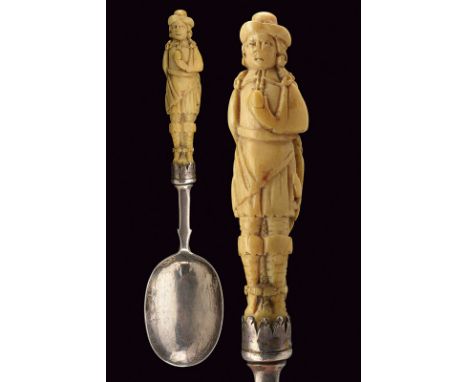 A carved hilt silver spoon dating: circa 1700 provenance: Holland Silver spoon with two stamps; bone grip carved as the effig