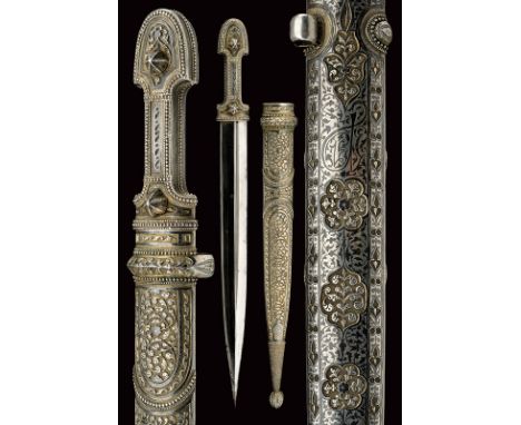 A beautiful kindjal with silver mounts dating: circa 1900 provenance: Caucasia Straight, double-edged blade with strongly elo