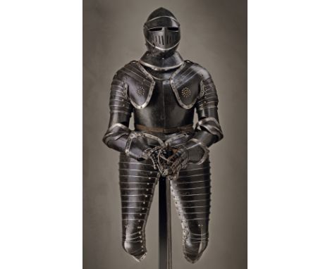 A black and white cuirassier armour dating: second quarter of the 17th Century provenance: Southern Germany Closed helmet wit