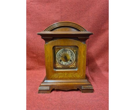 Mahogany cased bracket clock with Junghans 151 movement, case with inlaid decoration, silver Arabic numeral dial with brass s